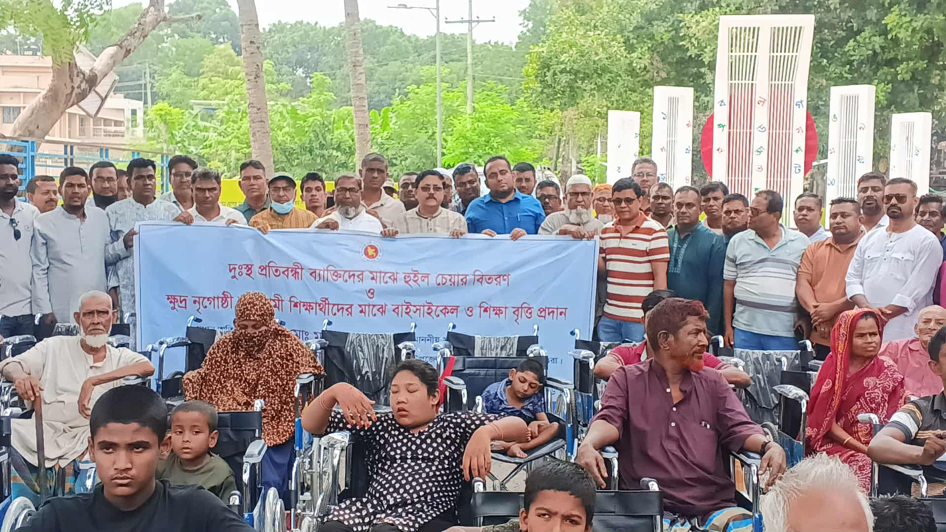 শ্রীপুরে হুইল চেয়ার-শিক্ষাবৃত্তির চেক ও বাইসাইকেল বিতরণ
